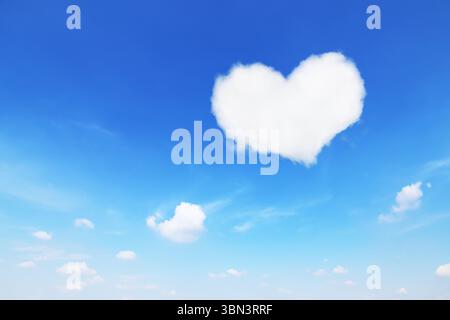 it is one white heart shaped cloud on blue sky. Stock Photo