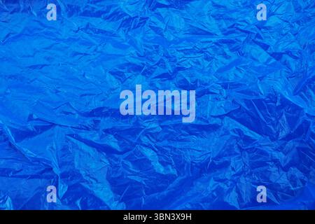 blue wrinkled plastic texture background. Stock Photo