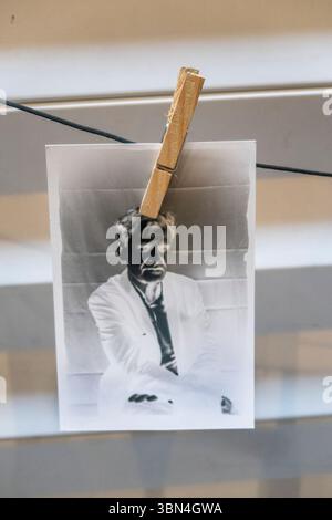 Photographie negative accrochee a un fil par une pince a linge * Negative photograph hanging on a wire with a clothes peg Stock Photo