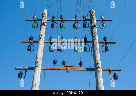 Power line pole with glass insulators Stock Photo