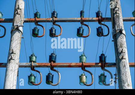 Power line pole with glass insulators Stock Photo