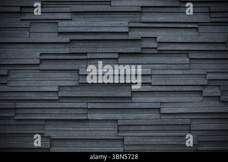 dark black modern brick wall for pattern and background. Stock Photo