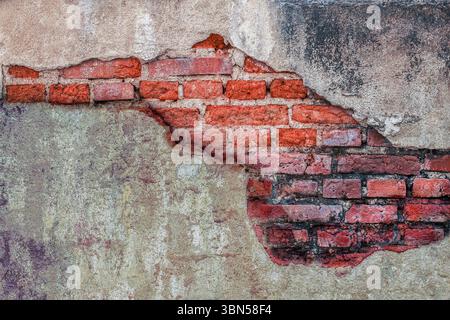 old brick wall with damaged concrete for background. Stock Photo