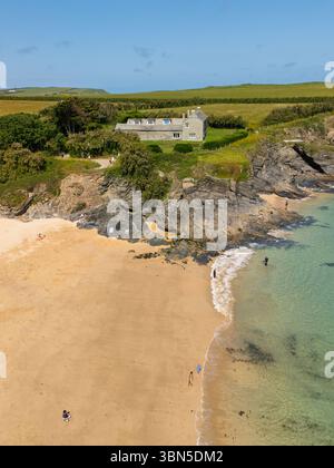 Aerial view of a serene coastal beach with calm turquoise waters ...