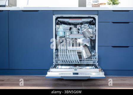Dishwasher in modern kitchen. Perfectly washing dishes, front view Stock Photo
