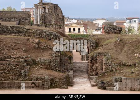 Crumbling walls and supporting columns of the roman theatre in mérida, spain, showing a vomitorium leading to the seating area Stock Photo