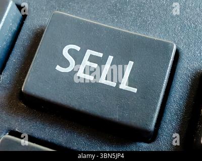 Close-up of "SELL" Key on Keyboard, Representing Sales, Marketing, and Business Transactions Stock Photo