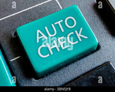 Close-up of Teal "AUTO CHECK" Key on Keyboard, Symbolizing Automation, Verification, and Quality Control Stock Photo