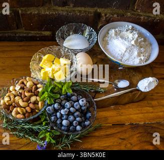 Composition of various ingredients and herbs which can be used for baking different flavours of muffins. Stock Photo