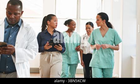 Healthcare Professionals Collaborating in a Modern Medical Facility Setting Stock Photo