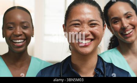 Friendly Smiling Medical Professionals United in a Group Setting Stock Photo