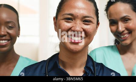 Smiling Medical Professionals in Team Collaboration and Caregiving Stock Photo