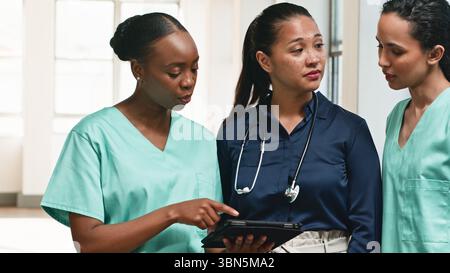 Healthcare Professionals Collaborating in a Hospital Setting Stock Photo