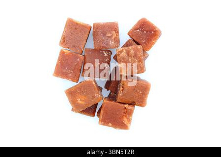 brown sugarcane cubes on white background. Stock Photo