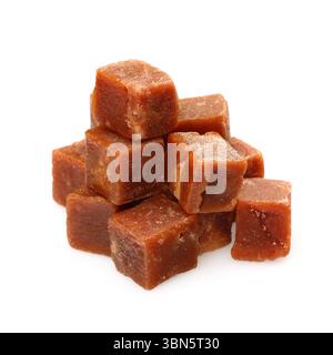 brown sugarcane cubes on white background. Stock Photo