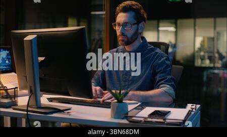 Caucasian middle-aged businessman stock market trader business man broker computer trading analyst CEO manager in night evening office professional Stock Photo
