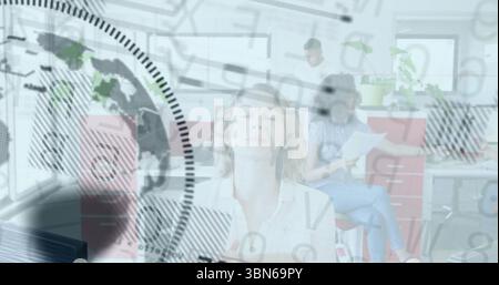 Business people in office with data processing image overlaying their activities Stock Photo