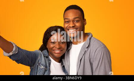 Closeup Of Positive African American Lovers Taking Selfie Together Stock Photo