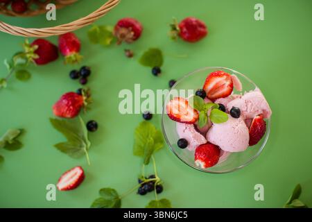 Berry dessert with mint and green composition. Stock Photo
