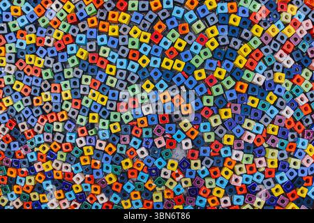 Colorful square beads arranged in mosaic pattern , abstract wide background symbolizing diversity and creativity. Stock Photo