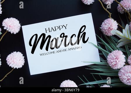 Happy March Welcome and be amazing text with flowers decorations on black background Stock Photo