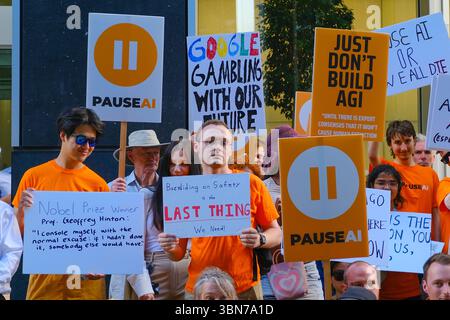 Pause AI activists protest outside Google DeepMind to demand greater transparency and regulation from AI tech companies to ensure safer development. Stock Photo