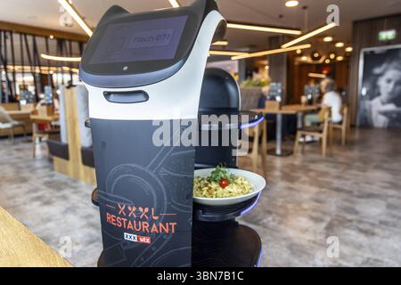 Furniture store XXXLutz Mann Mobilia Karlsruhe. In the restaurant, serving robot Lutzi supports the staff and brings the food to the table. Karlsruhe Stock Photo