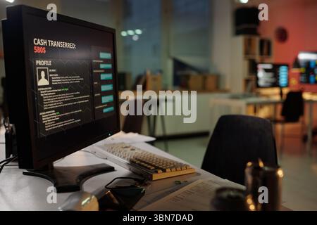 Close up view of computer monitor displaying amount of cash transferred and personal information in scam call center office with no people Stock Photo
