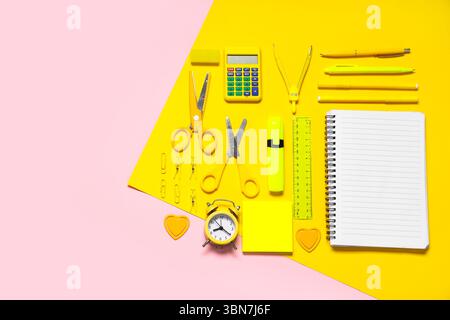 Composition with alarm clock, calculator and different school stationery on color background Stock Photo