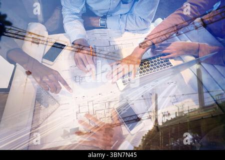 Business people discussing over blueprint in office Stock Photo
