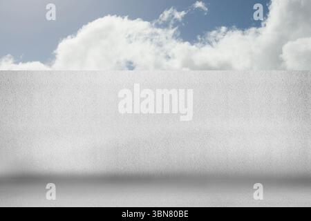 Flat design is showing blank white stucco wall and concrete floor under blue sky with clouds Stock Photo