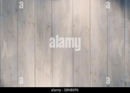 vertical wooden planks are forming flat design panel with visible grain patterns and knots Stock Photo