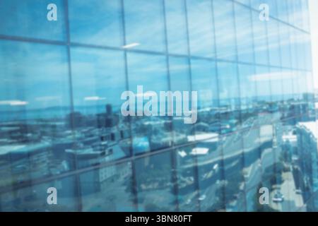 Graphic image of sky reflected in glass clad building Stock Photo - Alamy