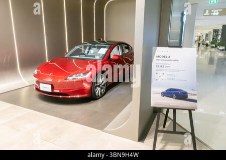 2025Tesla Model 3 in a showroom, promotional stand with price and car information, Bangkok, Thailand Stock Photo