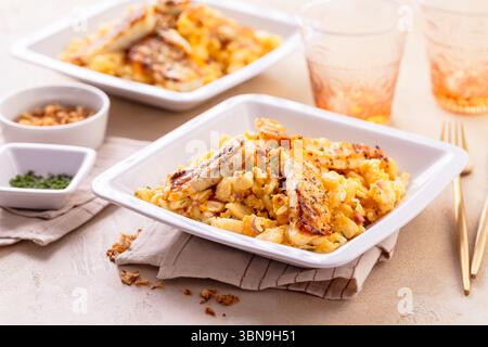 German egg dumplings with bacon, fried onions and grilled Halloumi cheese Stock Photo