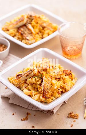 German egg dumplings with bacon, fried onions and grilled Halloumi cheese Stock Photo