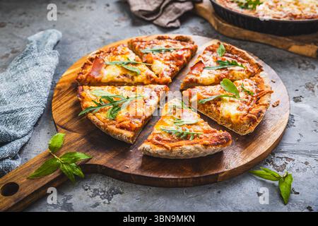 Fresh homemade Italian pizza with ham and buffalo mozzarella Stock Photo