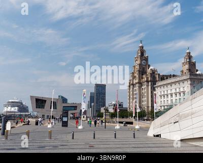 Tourists in the Pier Head area with the Cunard Building and Royal Liver Building. Cruise ship far left. Liverpool, Merseyside, England. June 30, 2025 Stock Photo