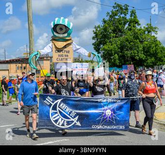New Orleans, LA, USA - June 14, 2025: Krewe of Lune, a carnival krewe, marches in the Marigny Neighborhood, during the No King's Parade protest against Donald Trump Stock Photo