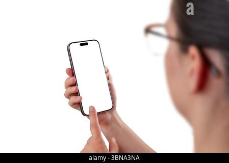 Woman using smartphone with blank screen, perfect for app interface mockups, user interaction concepts, or digital service promotion Stock Photo