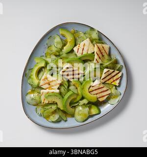 freshly sliced ​​avocado in a plate isolated nature background with clipping path Stock Photo