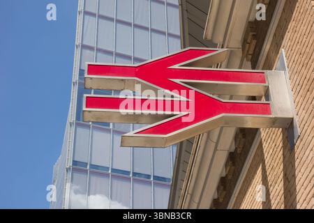 Closeup of National Rail double arrow logo outside London Bridge Station, London, England, UK Stock Photo