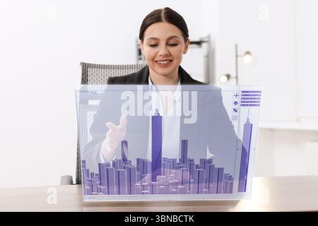 Building information modelling. Woman using virtual screen in office Stock Photo