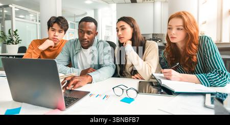 Group of focused international people using laptop at classroom Stock Photo