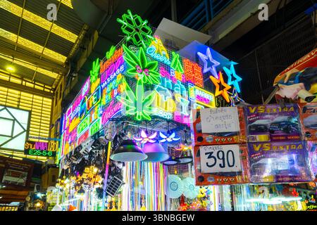 Colorful neon signs sold at historic Khlong Thom Market, Bangkok, Thailand Stock Photo
