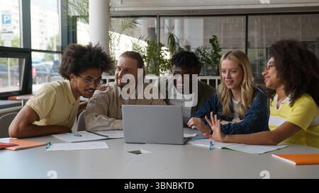Group of multiracial diversity students e-learning together studying in high school pupils gathering men women girls guys in college university with Stock Photo