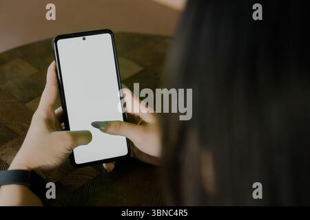 Captivating image of a woman interacting with a mobile device, emphasizing digital communication and modern lifestyle. Perfect to highlight innovative Stock Photo