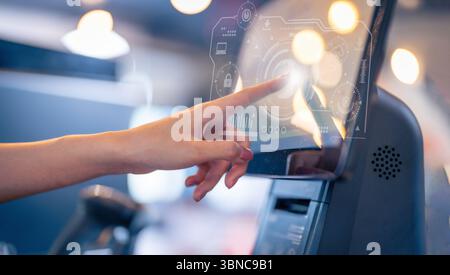Closeup of Human finger pointing on the glowing computer screen with blue Stock Photo