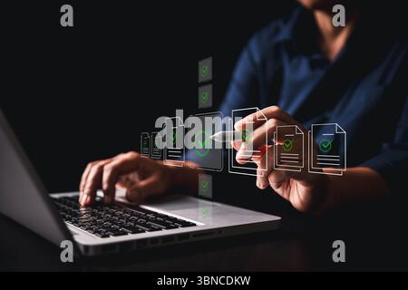 Businesswoman approving digital documents online checklist interface, embracing concept of paperless office task management, business processes, appro Stock Photo