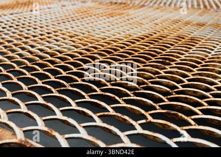 Corroded steel grating floor. Background Stock Photo